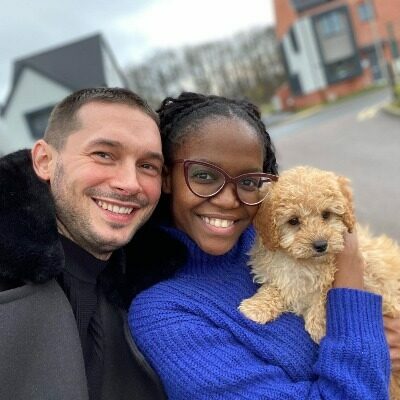 oti and her husband with their dog