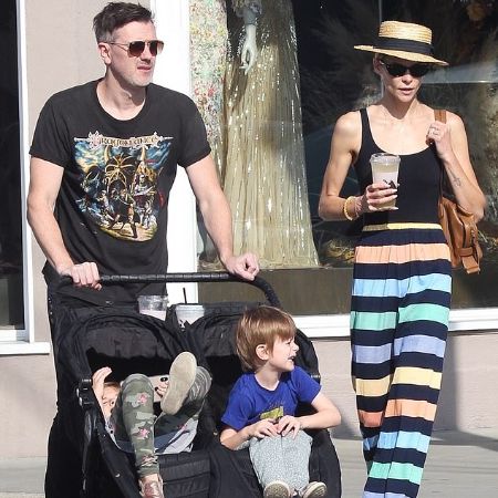 King and Kyle taking their toddlers on a stroll
