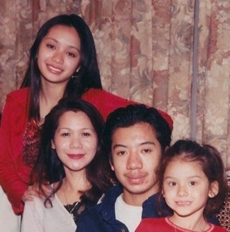 Michelle Phan (left) with her mother, stepfather, and half-sister