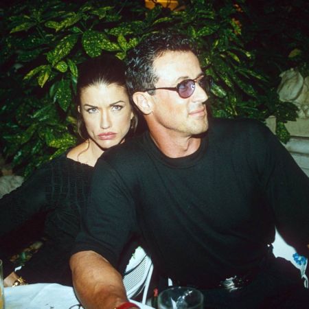 Sly with Janice Dickinson at an event
