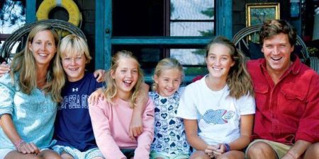 Tucker Carlson with his wife and their four children