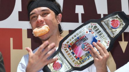 Matt Stonie posing with his National Doughnut Day Championship