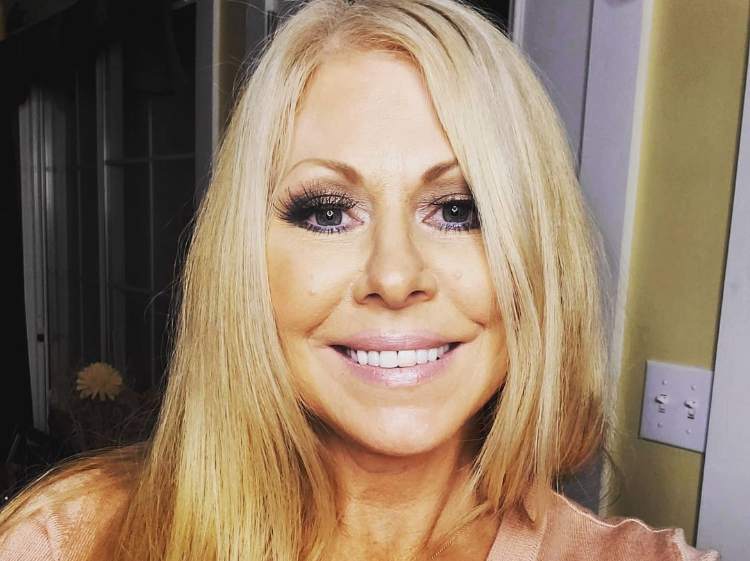 a smiling picture of Former WWE diva Terri Runnels